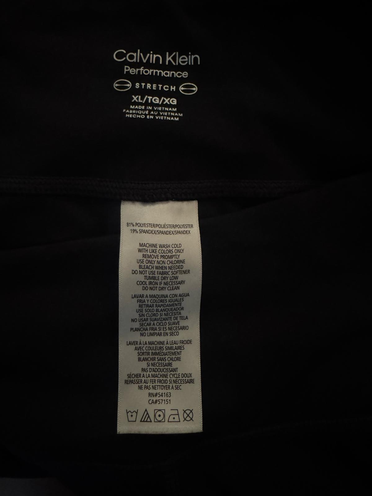 Black Calvin Klein Performance Stretch pants and zip-up sweatshirt set