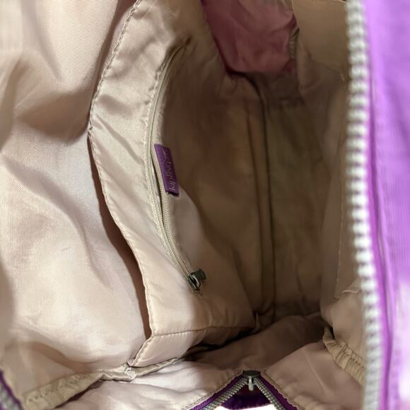 Kipling Bag pack mid sized in purple & Pink