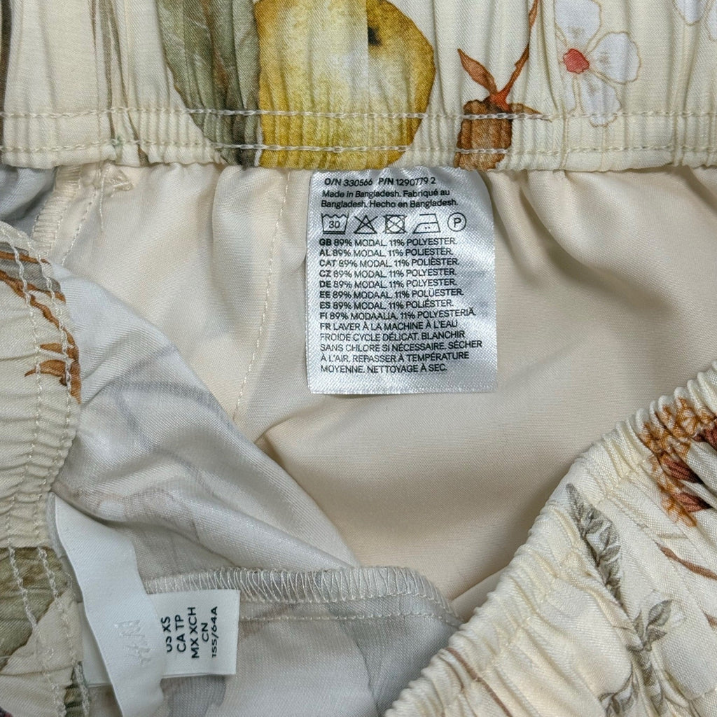 H&M woman's white floral pedal pusher pants in size XS