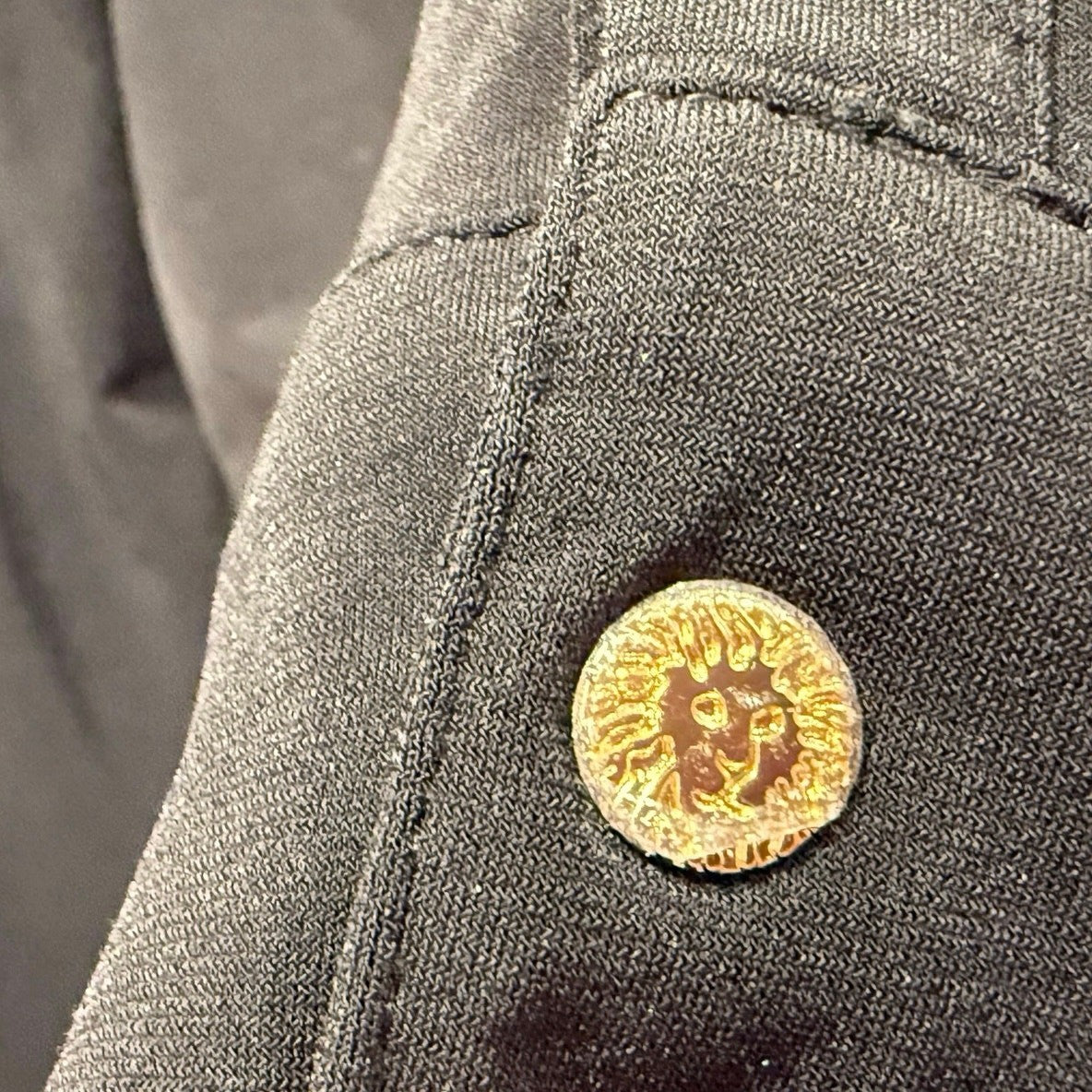 Ann Kline zippered woman's top in black with gold buttons