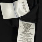 Ann Kline zippered woman's top in black with gold buttons