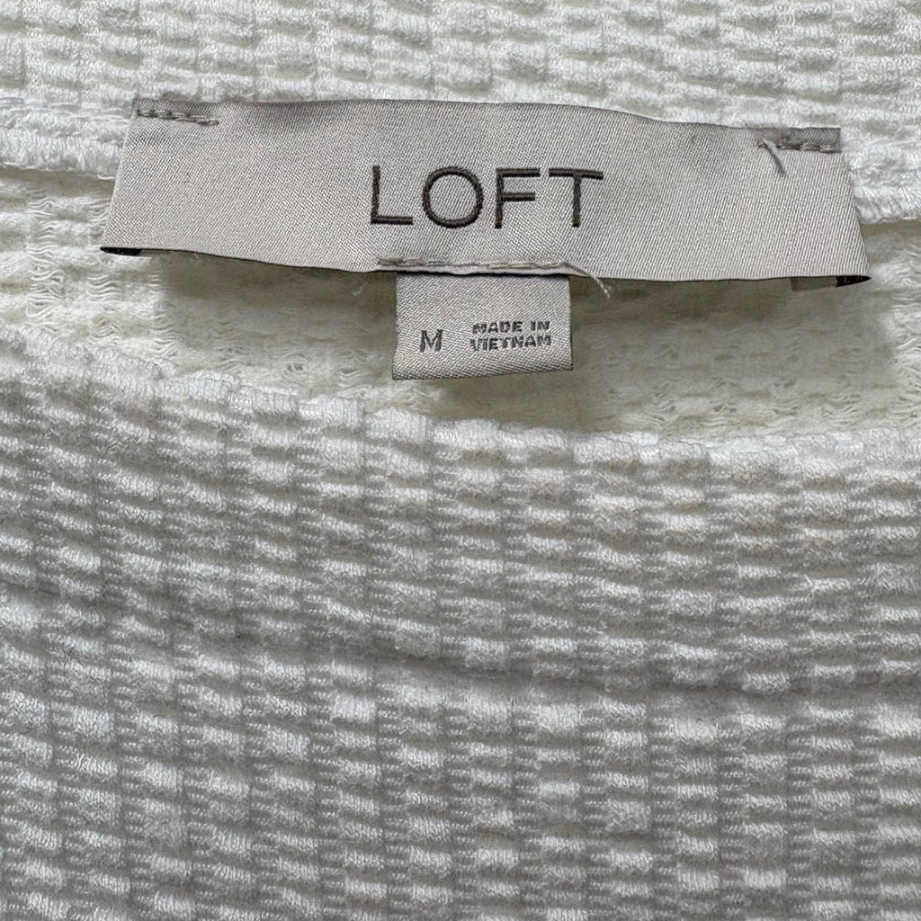 Loft woman's short sleeve top in white size M with tie bow at the bottom