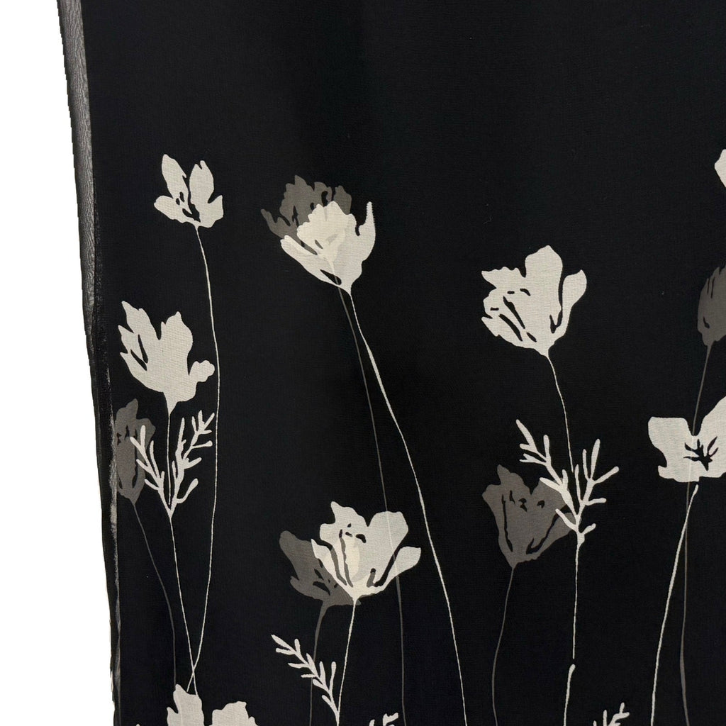 Ann Taylor woman's black skirt with white flowers in size 4