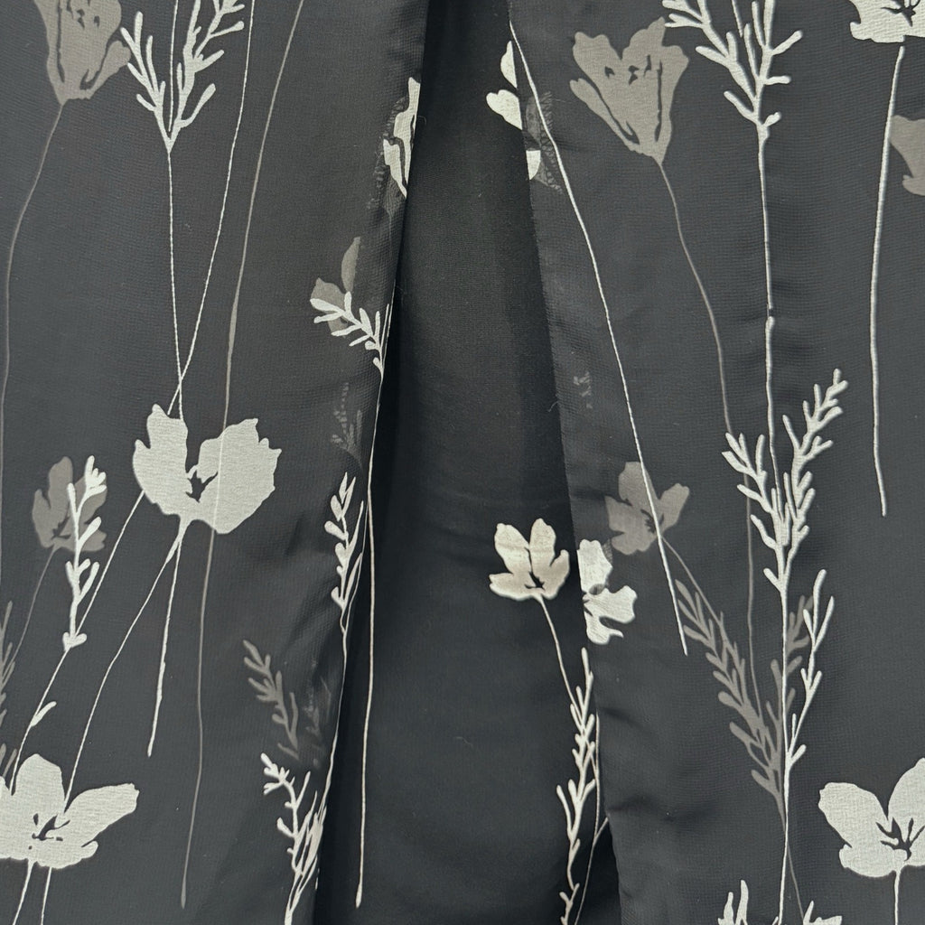 Ann Taylor woman's black skirt with white flowers in size 4