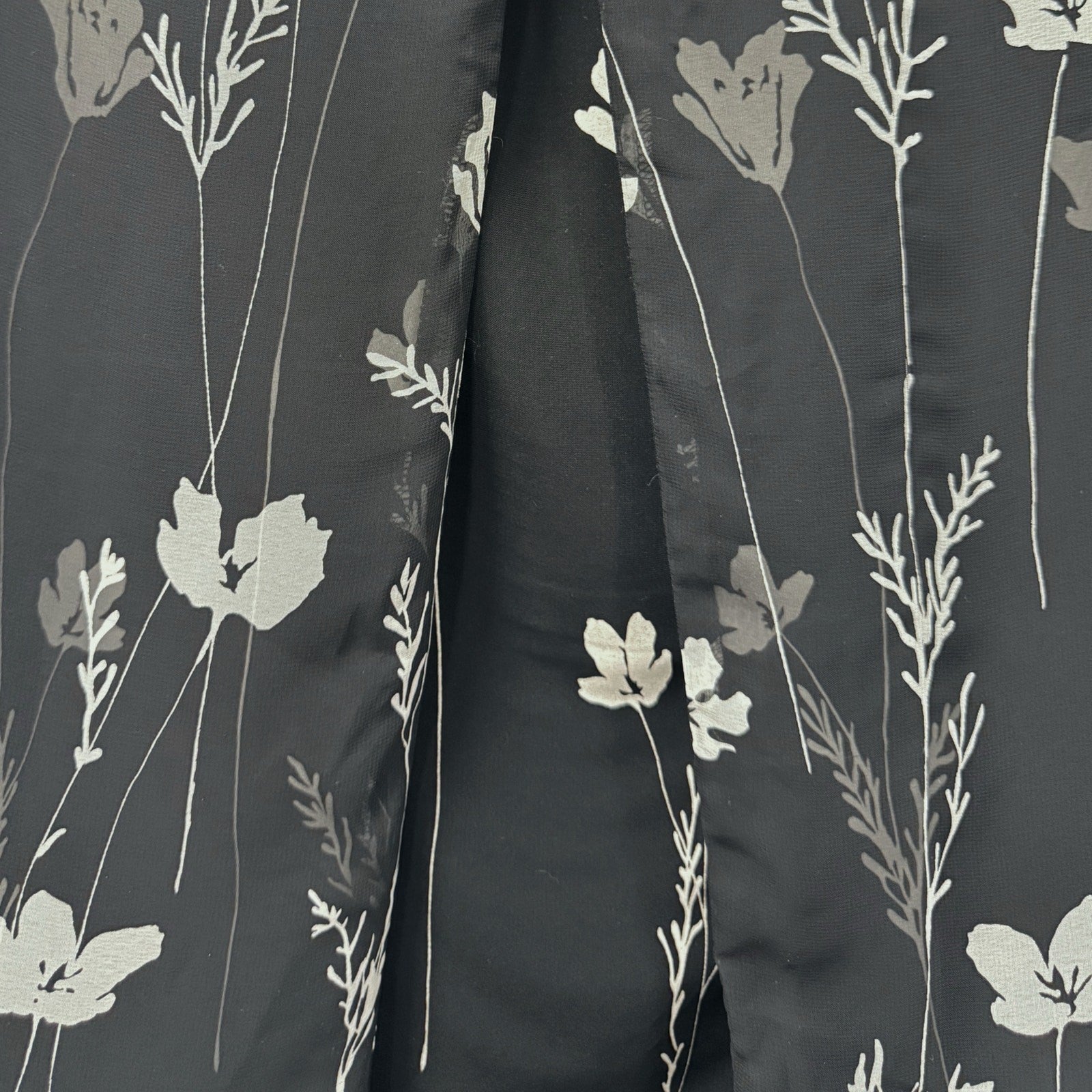 Ann Taylor woman's black skirt with white flowers in size 4